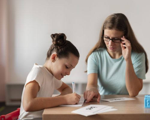 psychologist-helping-girl-speech-therapy